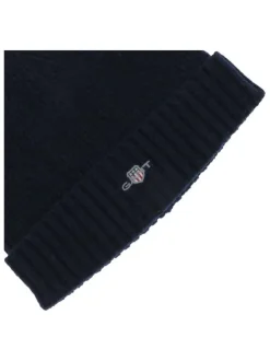 Bonnet marine uni coupe ajustée avec un logo brodé à l’avant