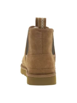 Boots en cuir camel à talon plat pourvues de soufflets élastiqués