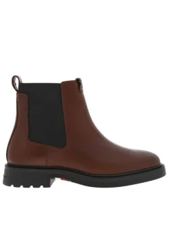 Boots en cuir cognac à talon décroché bas avec des soufflets élastiqués