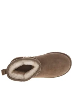 Boots en cuir de vachette beige, fourrées en laine, à semelle plate adhérente