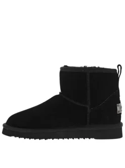 Boots en cuir de vachette noir, fourrées en laine, à semelle plate adhérente