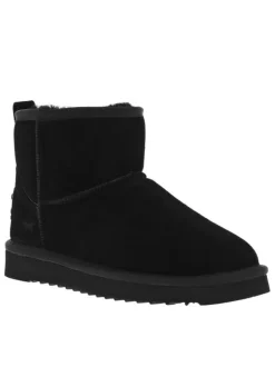 Boots en cuir de vachette noir, fourrées en laine, à semelle plate adhérente