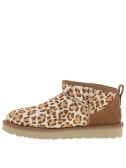 Boots en cuir léopard à talon plat avec languette d’aisance à l’arrière