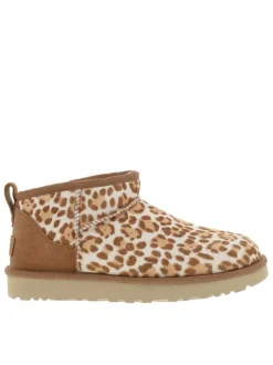 Boots en cuir léopard à talon plat avec languette d’aisance à l’arrière