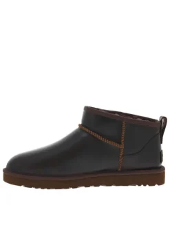 Boots en cuir marron à talon plat avec une doublure en fausse fourrure