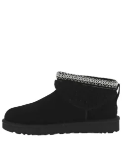 Boots en cuir noires à talon plat avec col brodé, sherpa et intérieur fourré