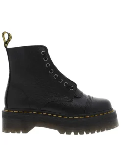 Boots en cuir noires à talon plateau avec un zip et revêtement en grains
