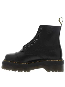 Boots en cuir noires à talon plateau avec un zip et revêtement en grains