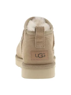 Boots en cuir sable à talon plat avec une languette d'enfilage