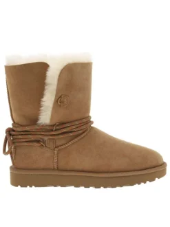 Boots en cuir taupe à talon plat cranté avec des lacets ronds