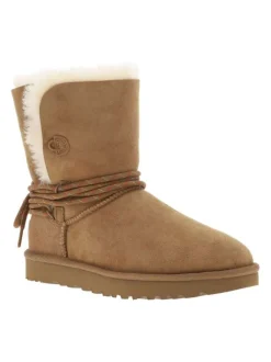 Boots en cuir taupe à talon plat cranté avec des lacets ronds