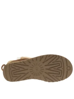 Boots en cuir taupe à talon plat cranté avec des lacets ronds