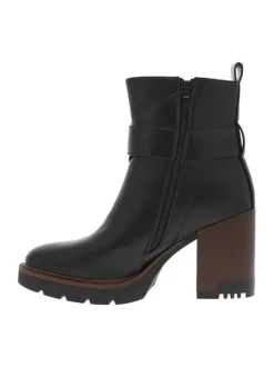 Boots noires à talon décroché haut avec un zip et une boucle décorative