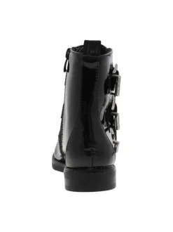 Bottillons fourrés noirs vernis à talon bas, grosses boucles métallisées et zip