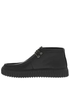 Bottines en cuir noires à semelle striée plates et à lacets ronds tressés