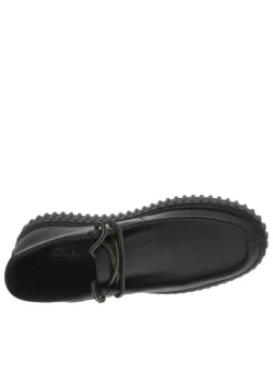 Bottines en cuir noires à semelle striée plates et à lacets ronds tressés