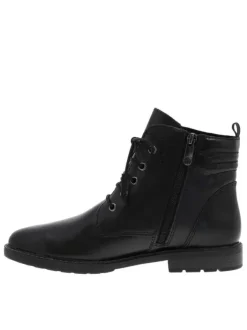 Bottines en cuir noires à talon plat avec un effet matelassé à l'arrière