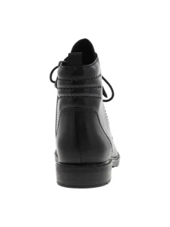 Bottines en cuir noires à talon plat avec un effet matelassé à l'arrière