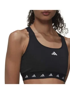 Brassière noire à col rond avec dos nageur et logo blanc floqué autour de la taille élastiquée