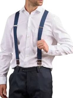 Bretelles marine à pois en blanc avec clip de fermeture sur le bas
