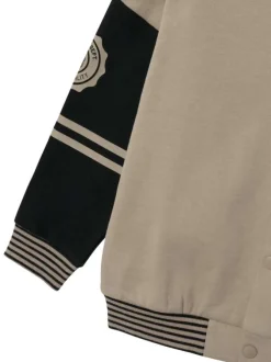 Cardigan boutonné en coton taupe avec un col rond et des manches longues noires
