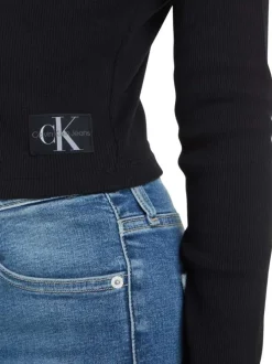 Cardigan en coton mélangé noir avec une coupe près du corps et un col v