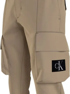 Cargo beige uni avec une coupe skinny fit et un lien de serrage à la taille