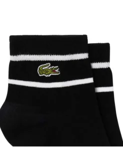 Chaussettes basses en coton mélangé noires et blanches rayées avec logo vert