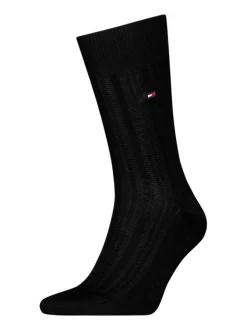 Chaussettes noires unies en coton à coupe haute et à logo brodé