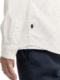 Chemise blanche en coton pourvu d'un col à rabats et d'un motif à pois