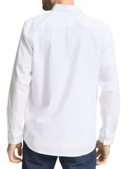 Chemise blanche uni avec un col boutonné et des manches longues