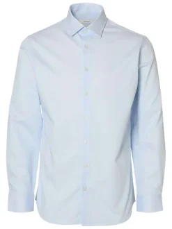 Chemise blanche unie avec un col boutonné et des manches longues