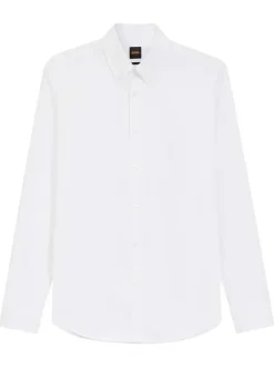 Chemise blanche unie en coton avec une coupe droite et un col à revers