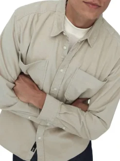 Chemise écrue unie en coton avec une coupe droite et un col à revers