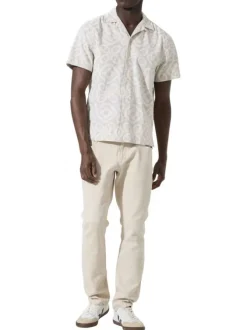 Chemise en coton beige à motifs abstraits imprimés avec une coupe droite