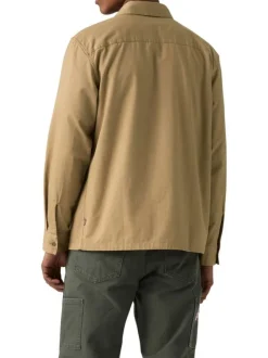 Chemise en coton beige unie avec un col chemise et fermeture par boutons