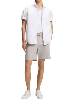 Chemise en coton blanche à coupe droite pourvue d'un col à revers