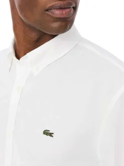 Chemise en coton blanche à coupe droite pourvue d'un col à revers