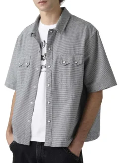 Chemise en coton blanche et noire unie avec une coupe droite et un col à revers