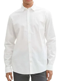 Chemise en coton blanche à pois avec une coupe droite et fermeture boutonnée