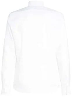 Chemise en coton blanche unie avec une coupe ajustée et les boutons cachés