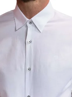 Chemise en coton blanche unie avec une coupe slim fit et des manches à pression