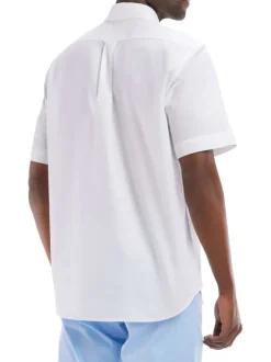Chemise en coton blanc unie avec une coupe et un droite col boutonné