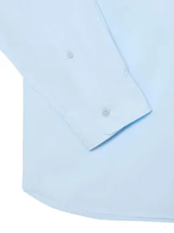 Chemise en coton bleu clair à coupe droite pourvue d'un col à revers