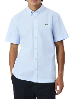 Chemise en coton bleu clair à coupe droite pourvue d'un col à revers