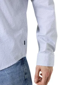 Chemise en coton bleue avec fermeture boutonnée et motif géométrique