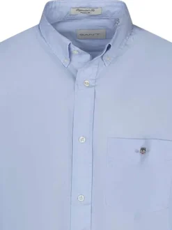 Chemise en coton bleue ciel unie à col américain avec une poche plaquée