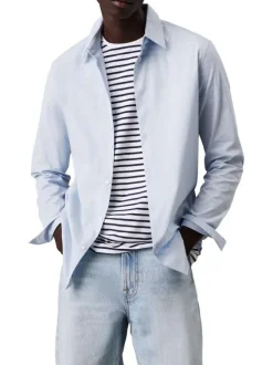 Chemise en coton bleue ciel unie à coupe regular fit fermée par des boutons