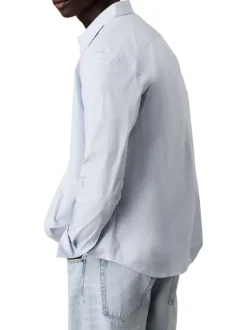 Chemise en coton bleue ciel unie à coupe regular fit fermée par des boutons