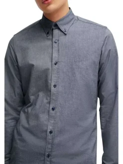 Chemise en coton bleue marine avec une coupe ajustée et des manches longues